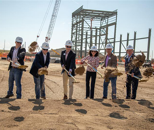 Shoveling at the ground breaking of PGSIV